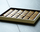 Shogi pieces craftsman "Fu-getsu 富月" made Mikurajima-hon-tsuge (Mikura Island grown boxwood), Tora-Moku (Tiger-striped wood grain), Minase-syo (Minase script), Mori-age(embossed) Shogi pieces SHK-FG510-01