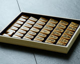 Shogi pieces craftsman "Fu-getsu 富月" made Mikurajima-hon-tsuge (Mikura Island grown boxwood), Tora-Moku (Tiger-striped wood grain), Minase-syo (Minase script), Mori-age(embossed) Shogi pieces SHK-FG510-01