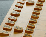 Shogi pieces craftsman "Fu-getsu 富月" made Satsuma-hon-tsuge (Satsuma boxwood) Inazuma-moku (lightning pattern wood grain), Ryoko-syo (Ryoko-syo script), Mori-age(embossed) Shogi pieces SHK-FG510-05