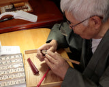 Shogi pieces craftsman "Tomiishi(富石)" made Satsuma-hon-tsuge (Satsuma boxwood) Aka-masa (strong reddish color and straight wood grain) Kinki-syo (Kinki script) mori-age (embossed) Shogi pieces