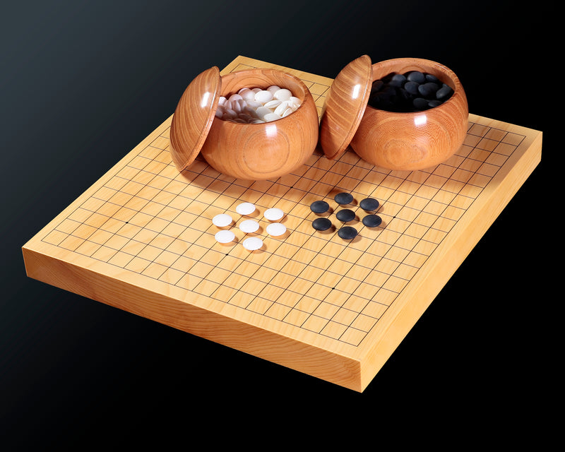 - Miniature 3-piece Go set 208-08 -  
Our Special Selection a set of 15 mm diameter Clamshell Go stones, miniature Go board No.76815 and Go bowls, 3-piece small-scale set.